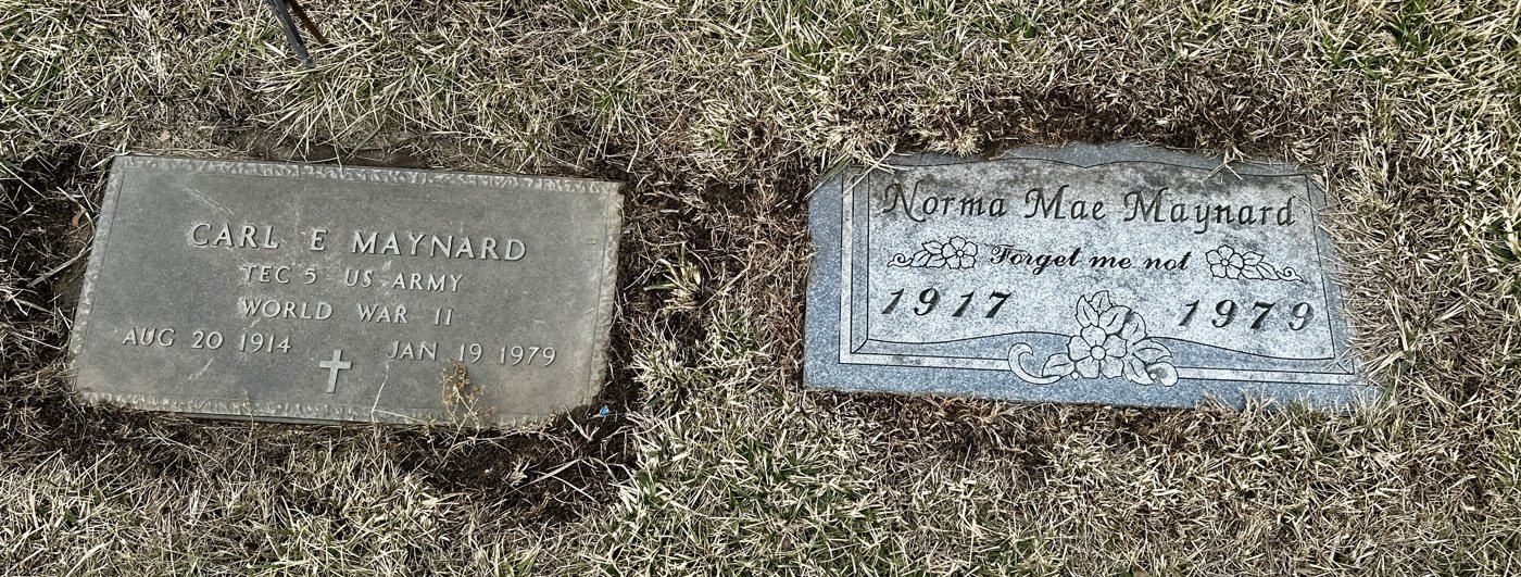 Two flat grave markers side by side: Carl E. Maynard, TEC 5 US Army, World War II, and Norma Mae Maynard, 1917–1979